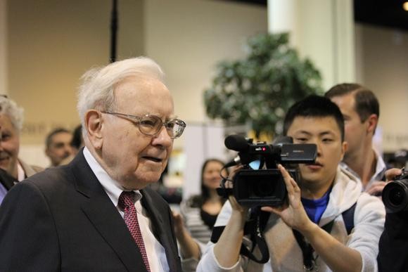 How does Warren Buffett choose the companies he buys