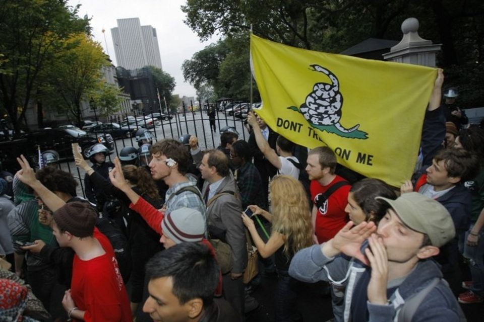 Wall Street s Charging Bull stays corralled Police guard statue during protest