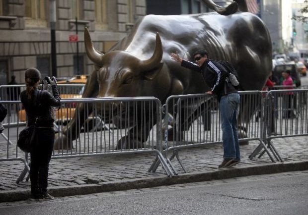 Wall Street s Charging Bull stays corralled Police guard statue during protest