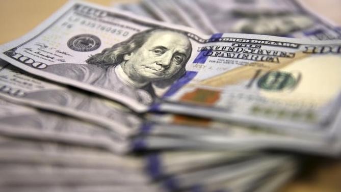 Dollar powers to fresh highs; stocks and oil fall